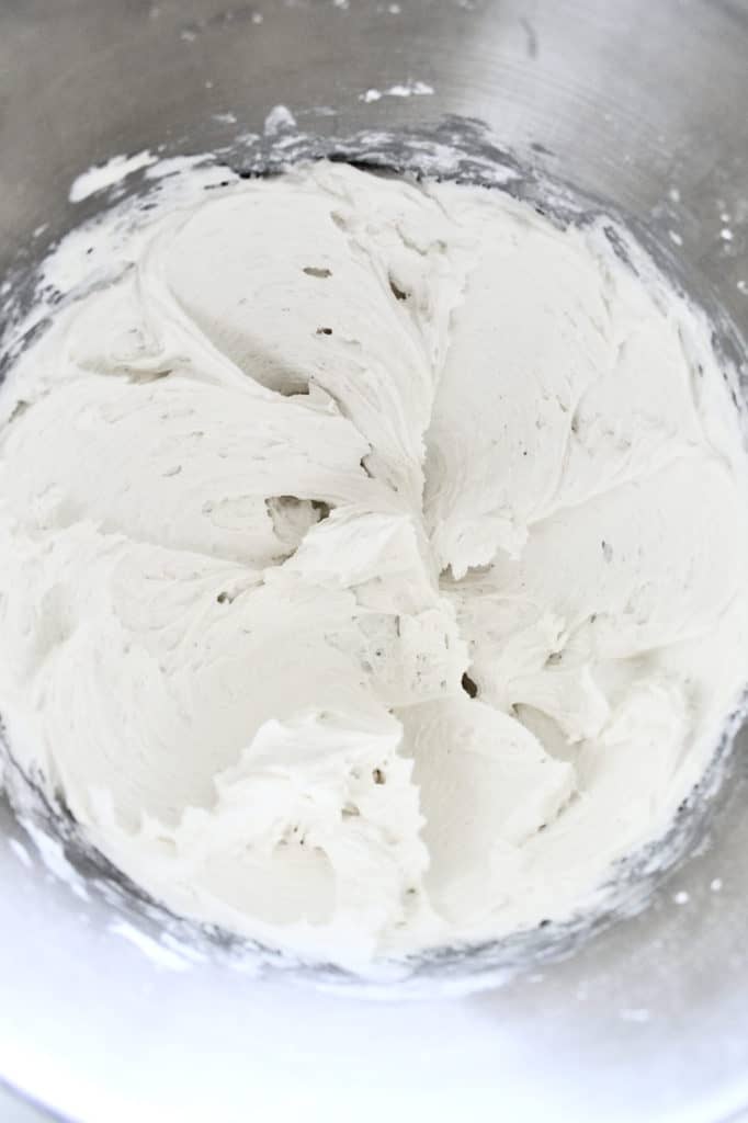 Bright, white vanilla buttercream in a bowl