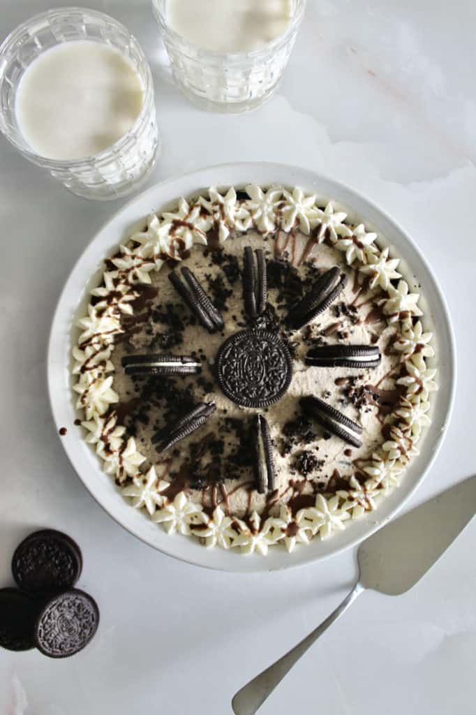 Overhead shot of Oreo pie, milk, and pie server