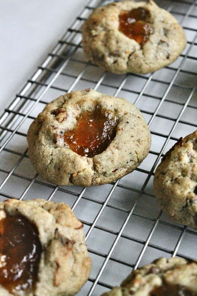 Baked Apple Dapple Thumbprint Cookies on a cooling rack