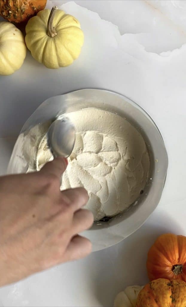 Assembling pumpkin chai latte cake layers