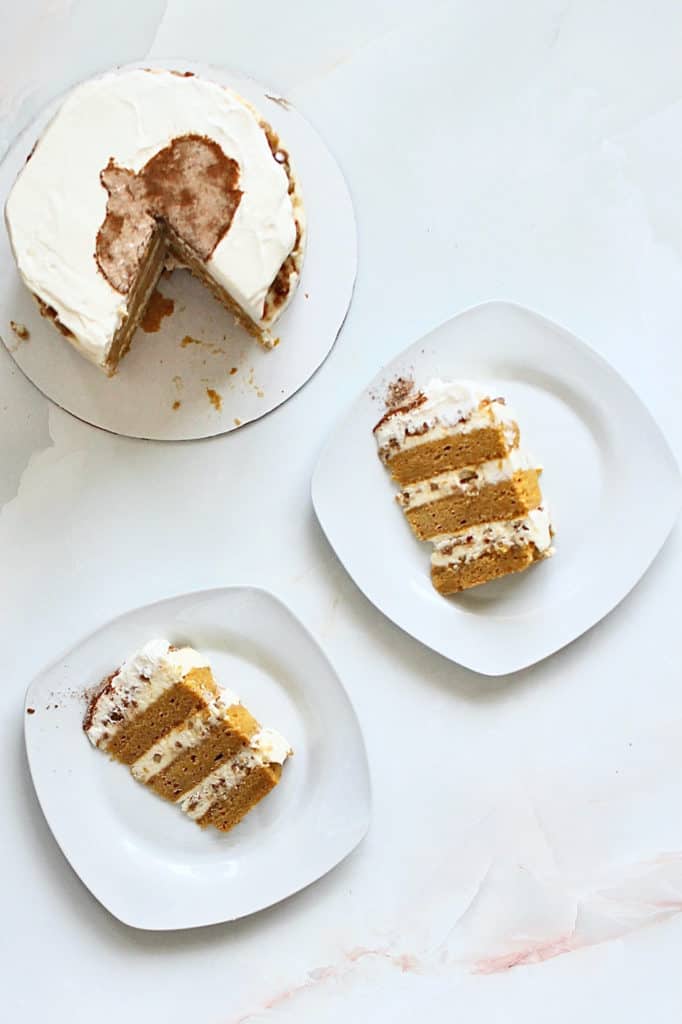 Overhead shot of slices of chai latte cake with pumpkin design