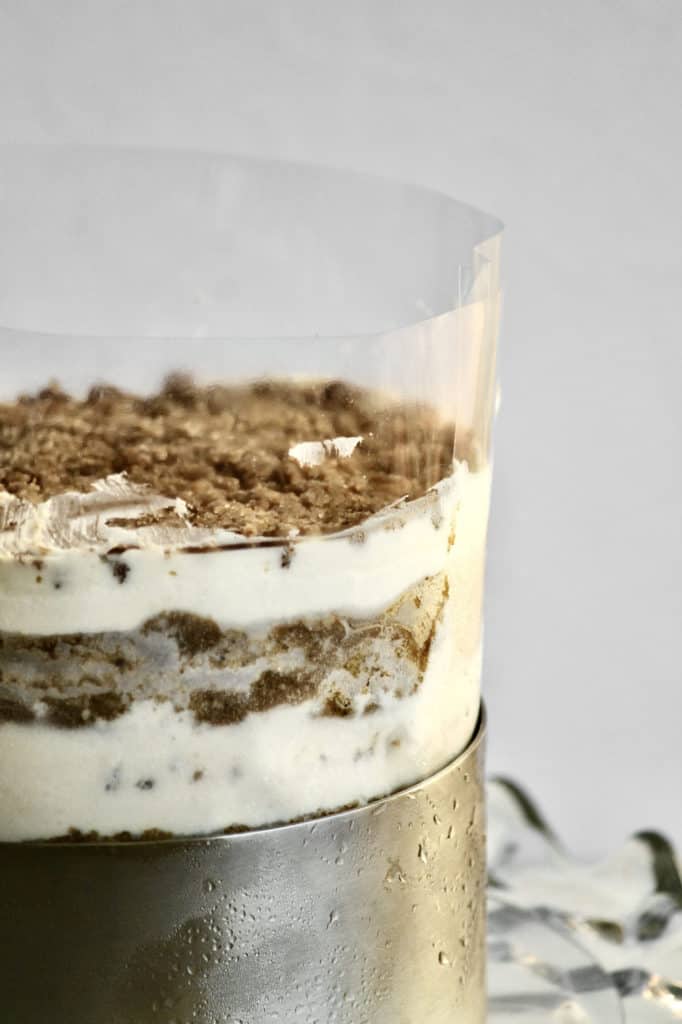 Acetate sheet holding pumpkin chai latte cake together in the cake ring