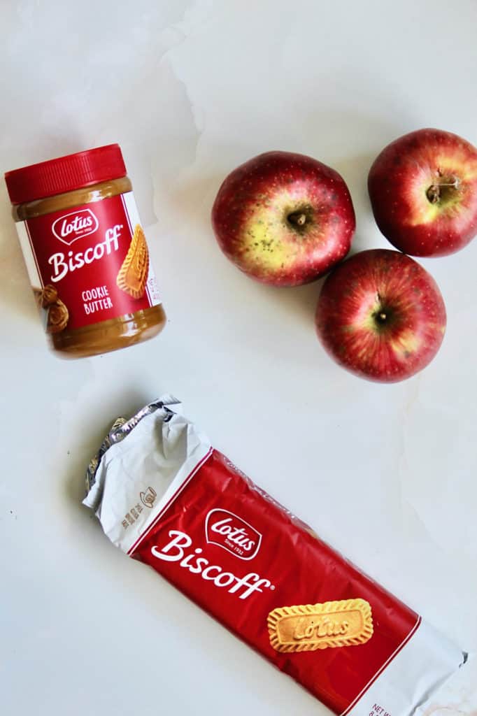 Overhead shot of ingredients for mini apple Bundt cakes, including Biscoff cookies and cookie butter