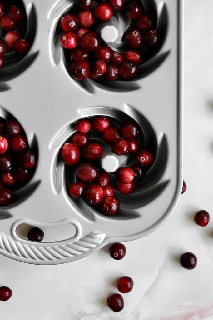 Overhead shot of cranberries in and scattered around baking pan