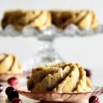 Mini Cranberry Bundt Cakes on cake stand and individual plates