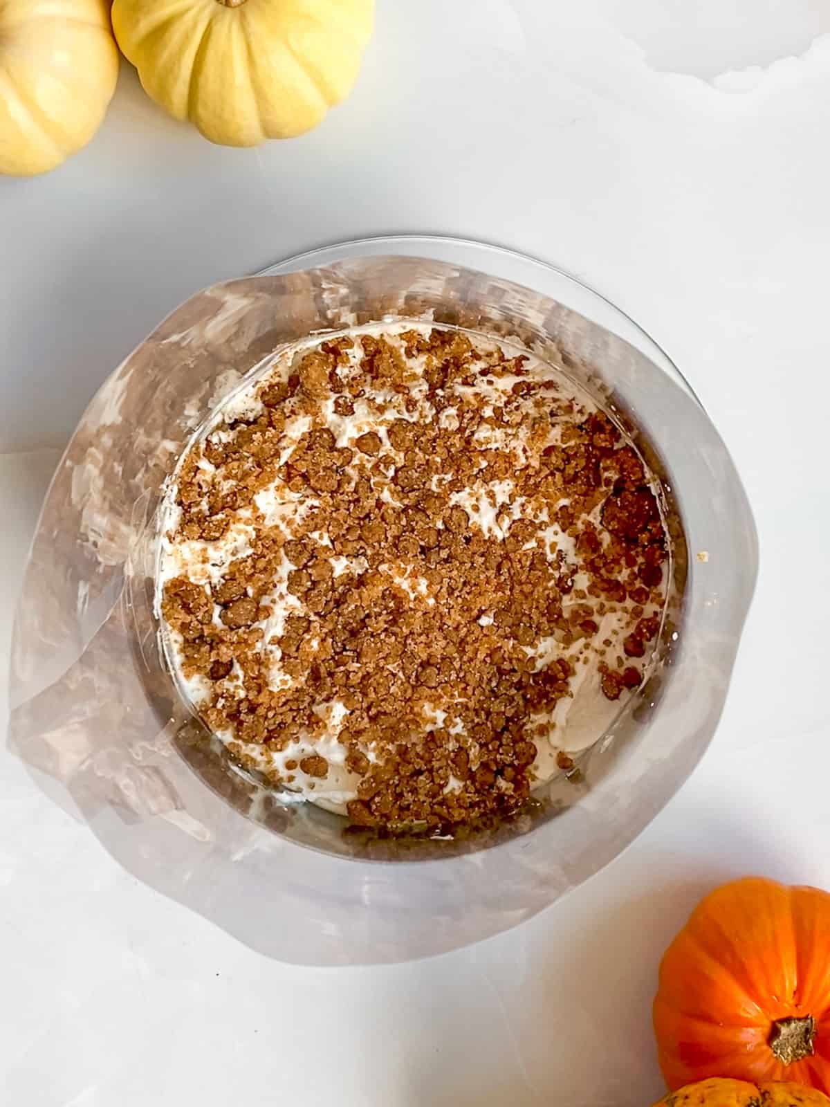Pumpkin chai cake fully stacked, before going into the freezer.