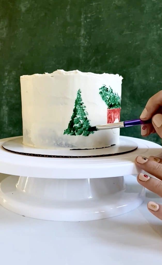 Painting trees on Christmas tree farm cake