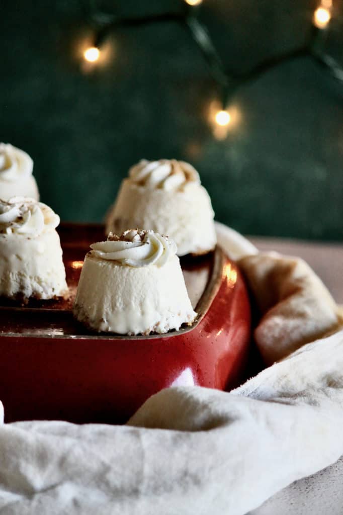 no-bake mini eggnog pies with christmas lights behind them