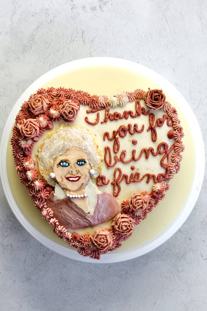 Overhead shot of painted cake, featuring Betty White