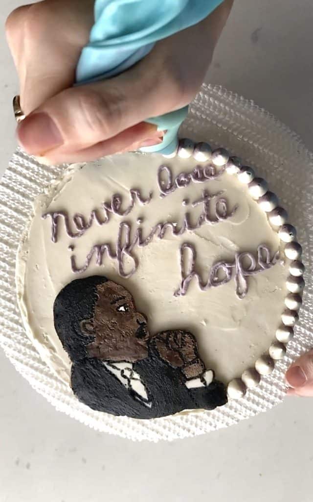 Piping cake border for Martin Luther King Jr. Cake