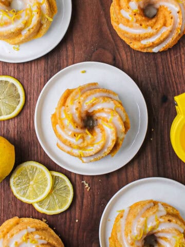 Mini lemon Bundt cakes glazed and garnished with lemon zest.