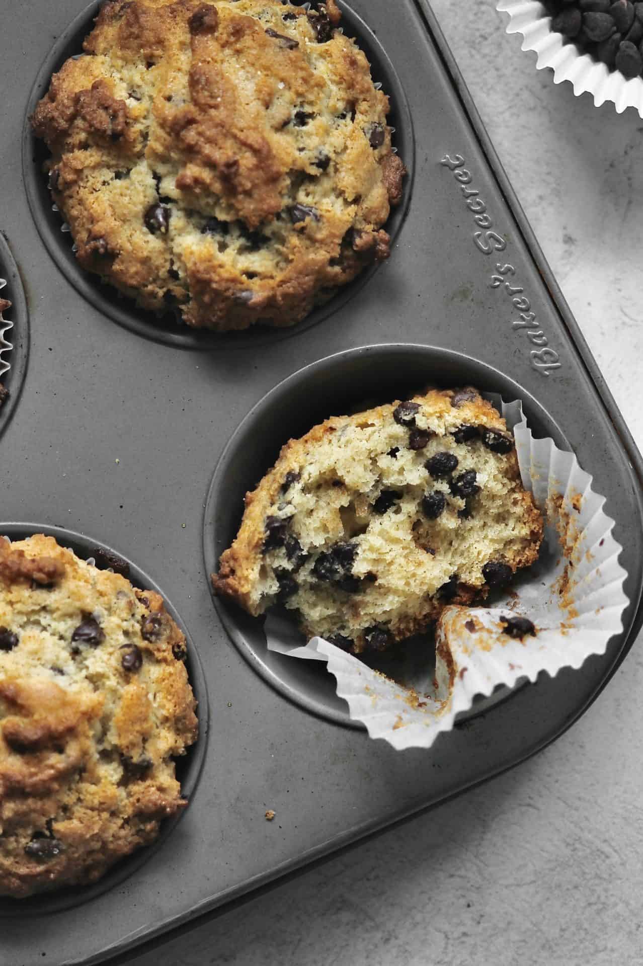 small batch chocolate chip muffin missing a bite