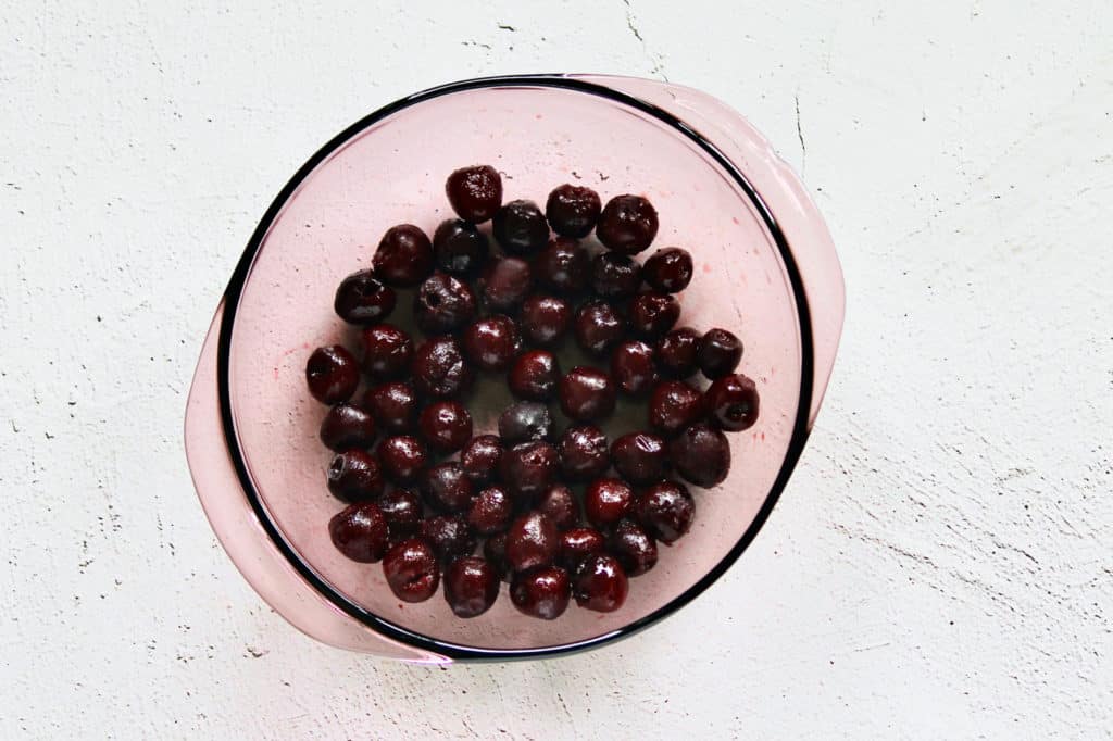 bowl of thawed sweet dark cherries