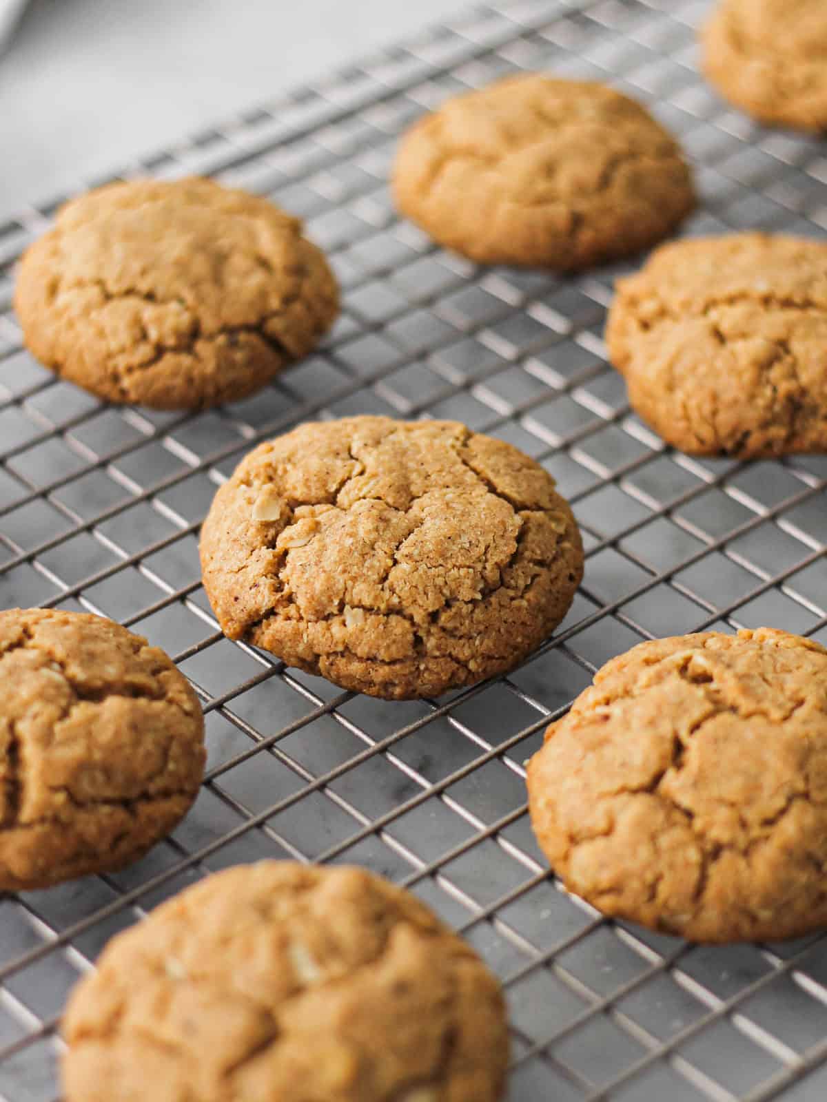 Baked Biscoff Sandwich Cookies on a wire rack.