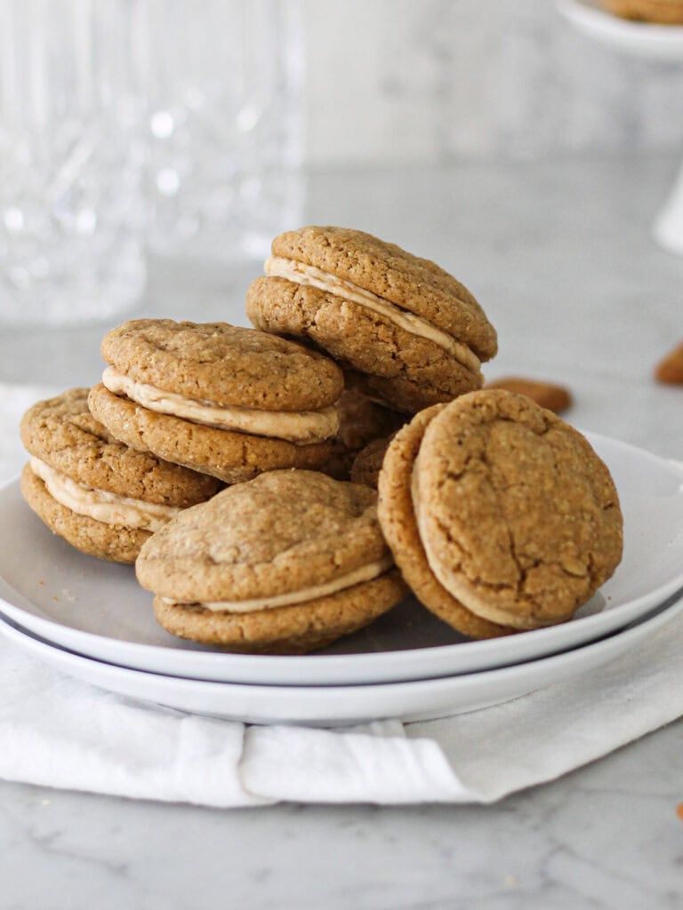 Soft and chewy Biscoff sandwich cookies filled with cookie butter frosting.