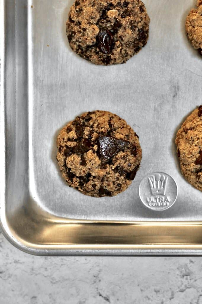 overhead image of oat flour cookies, baked with chocolate chunks in them