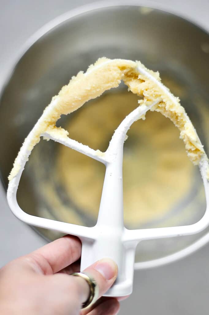 up-close image of paddle attachment, showing properly creamed butter and sugar for cupcake and cake recipes