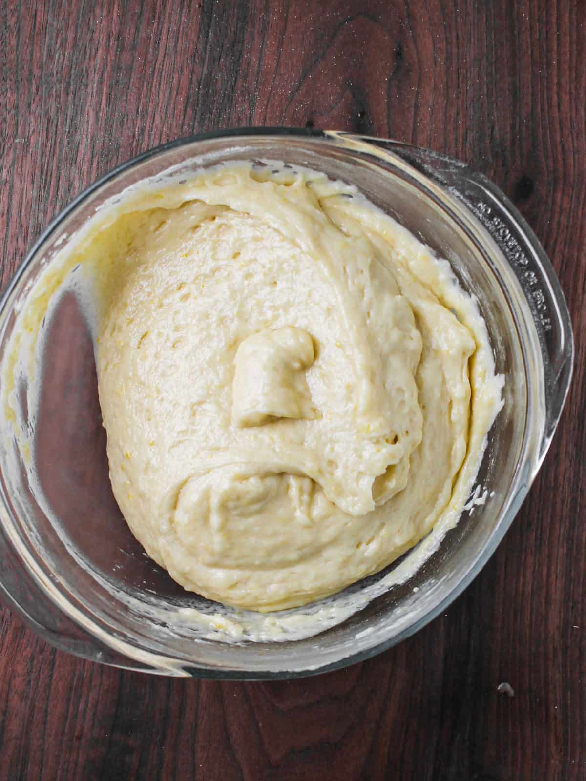 Batter for lemon cake in a mixing bowl.