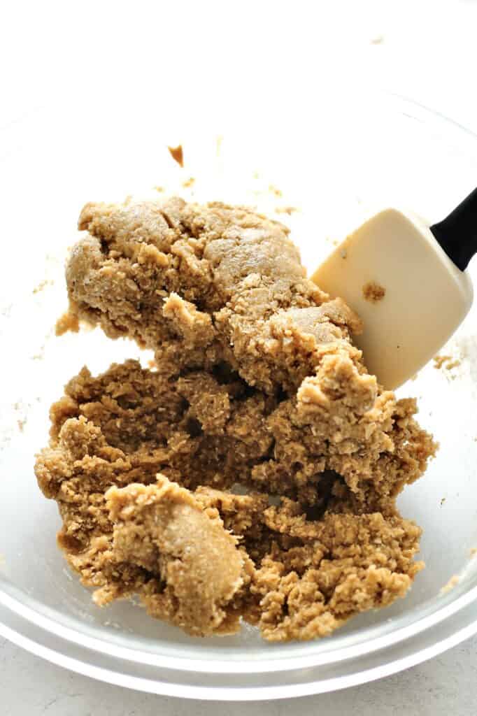 bowl of wet ingredients mixed with dry ingredients for soft peanut butter cookies