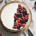 overhead image of mascarpone cheesecake with berries on top
