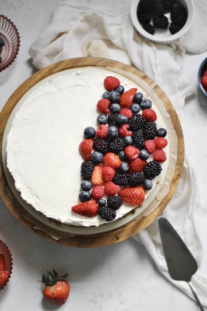 overhead image of mascarpone cheesecake with berries on top