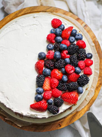 Overhead image of no bake mascarpone cheesecake with berries on top.