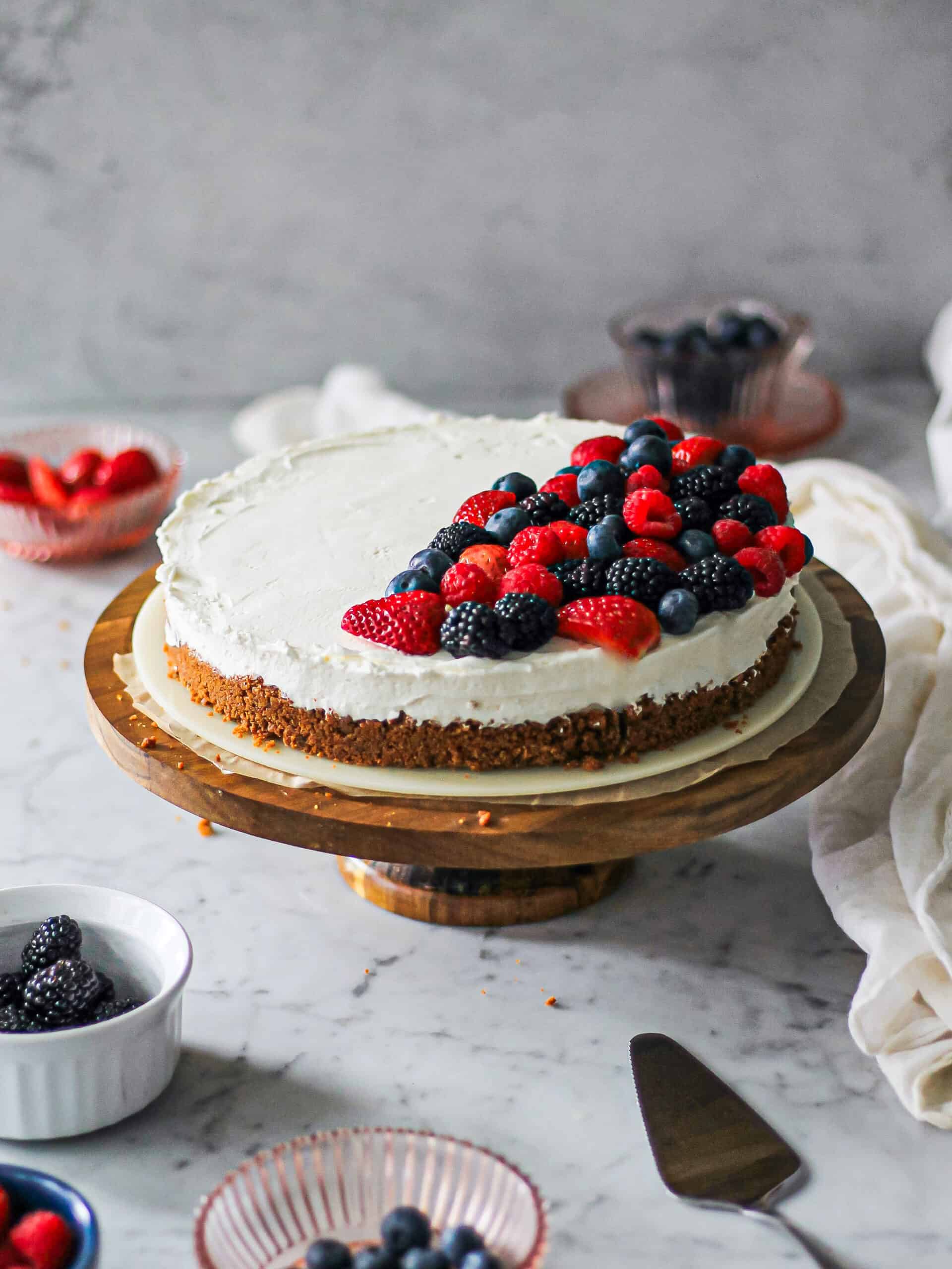 No bake cheesecake with mascarpone, dressed with berries on top.