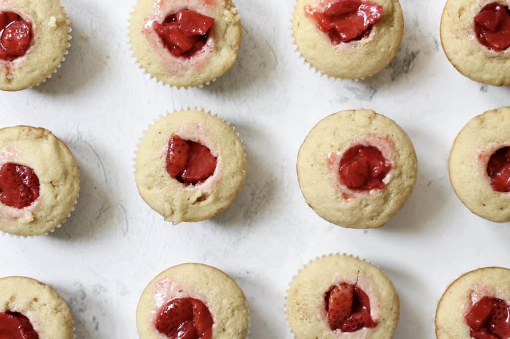 vanilla cupcakes filled with roasted strawberries