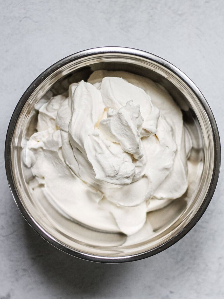 Medium stiff peaks of mascarpone, heavy cream, and powdered sugar.