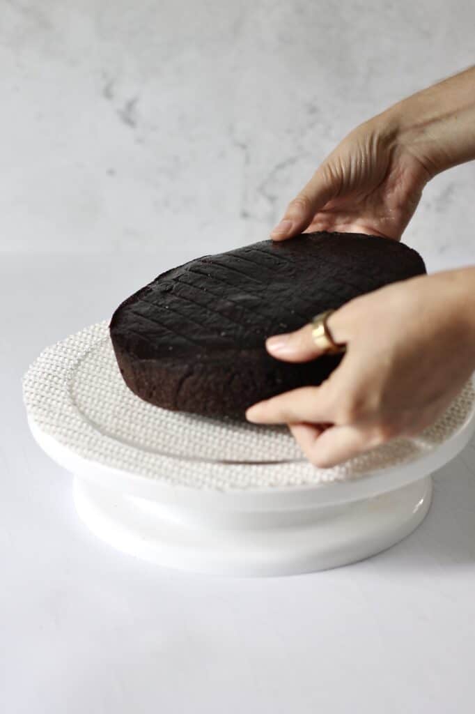 moist chocolate cake on a white cake turntable