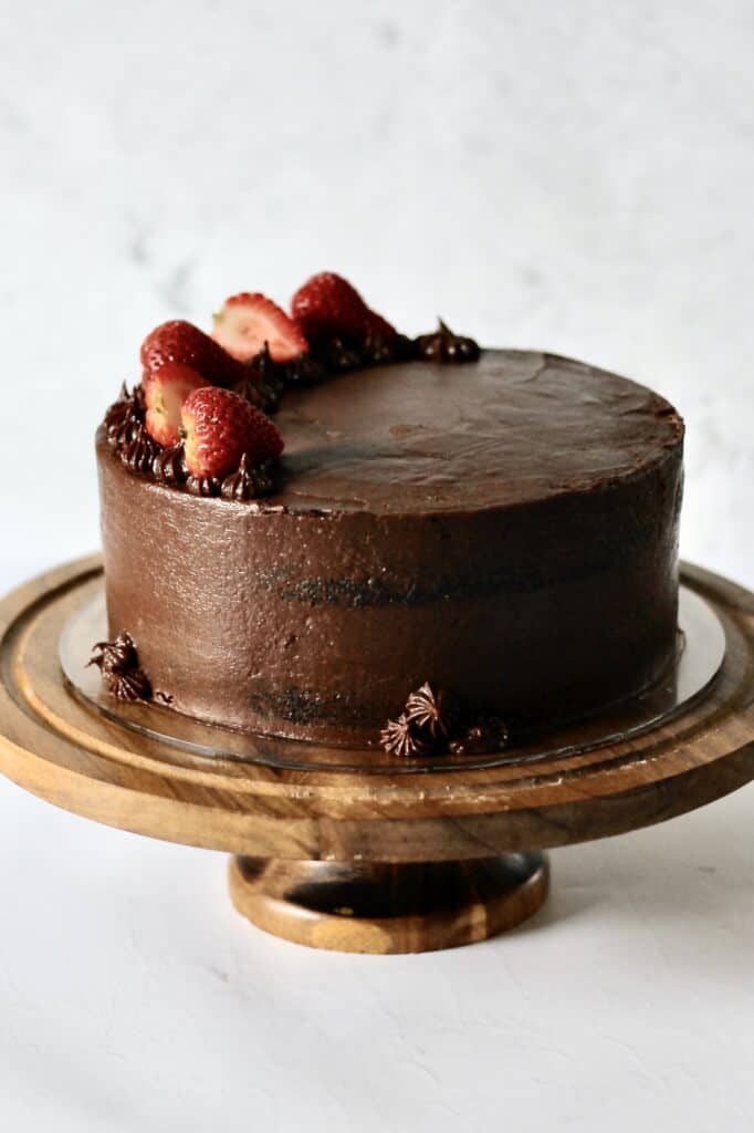 chocolate layer cake with strawberry slices on the top