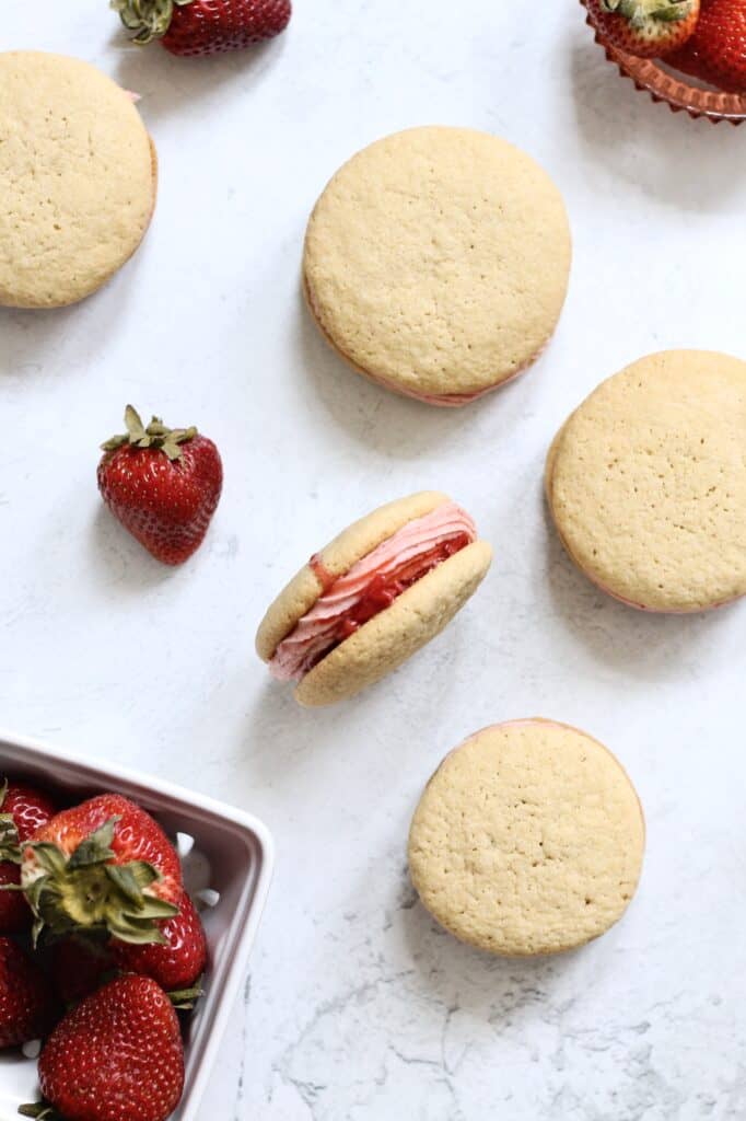 overhead shot of strawberry cookie sandwich with berry juice showing between layers