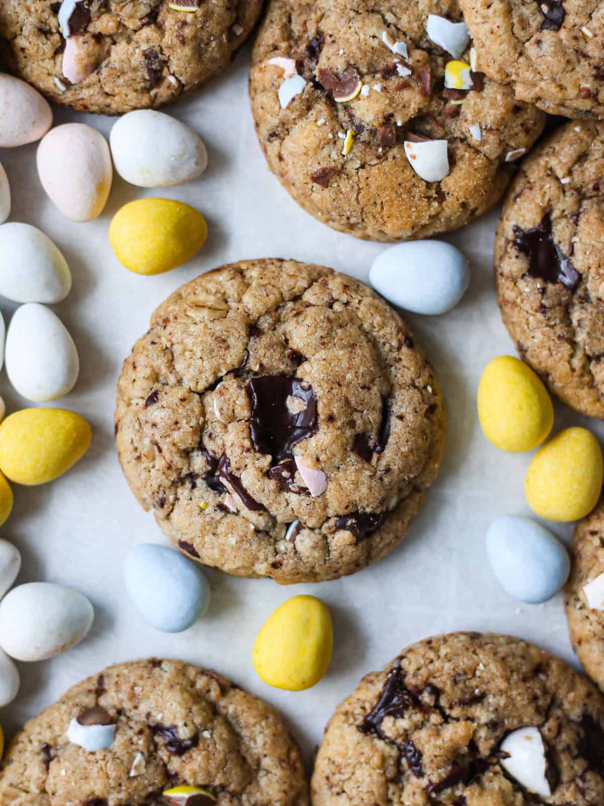 Big batch chocolate chip cookies that have a holiday twist from pastel mini Cadbury eggs for springtime baking.
