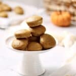 stack of mini pumpkin muffins on a white cake stand