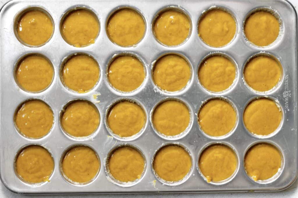 batter for mini pumpkin muffins in mini muffin pan