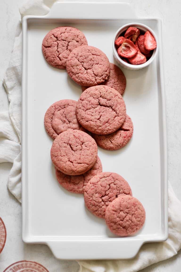 pink sugar cookies on a white platter