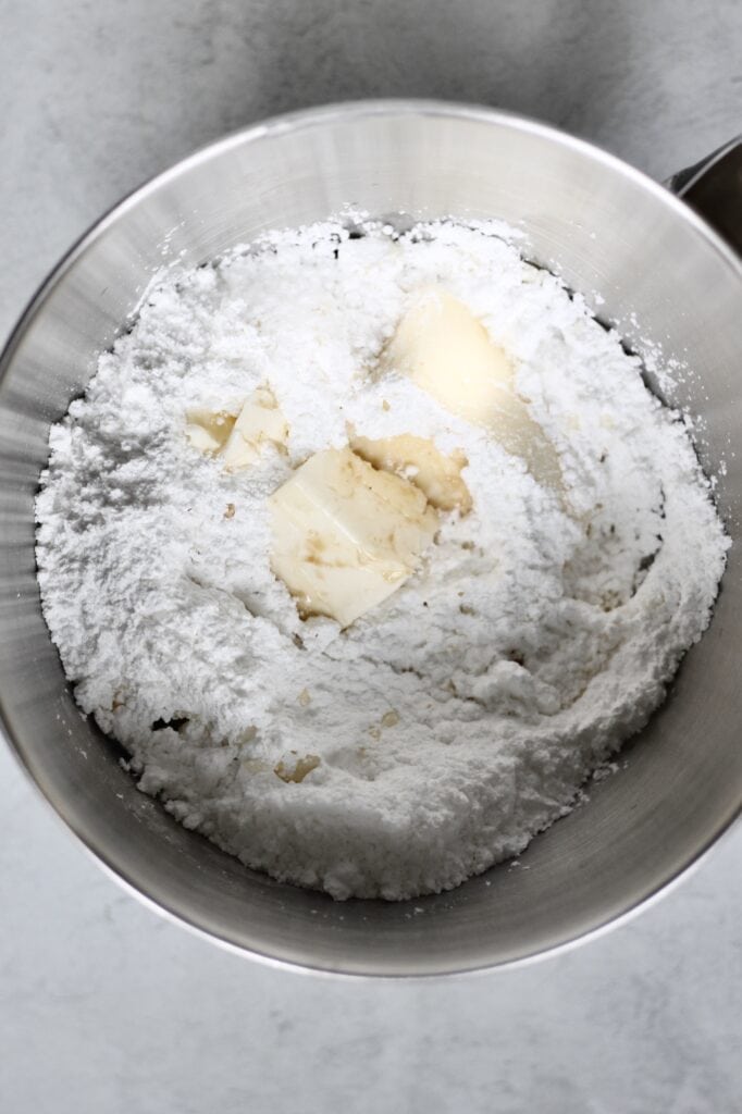 bowl of butter and powdered sugar for making homemade frosting