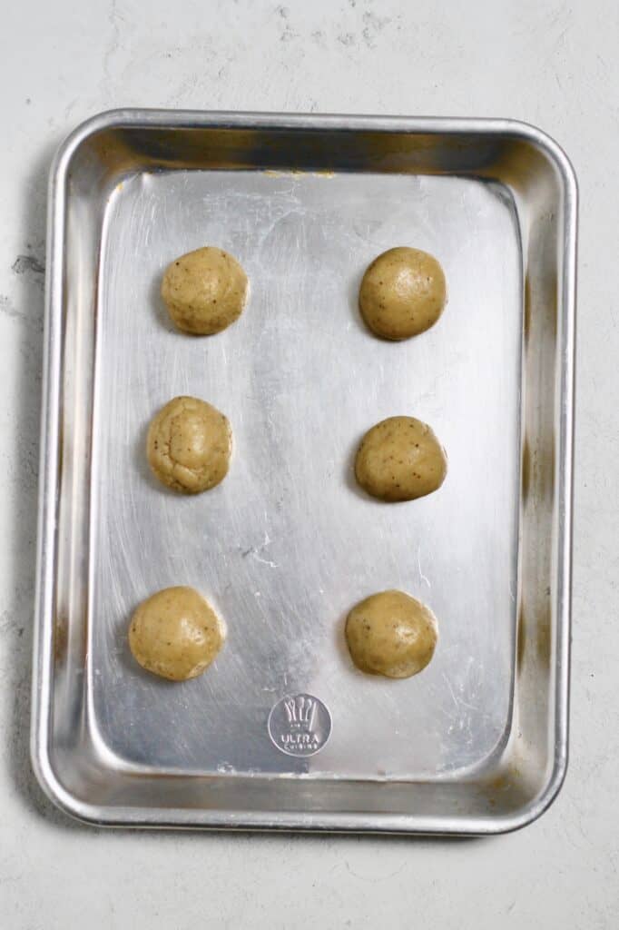 dough ball on pan for sugar cookies