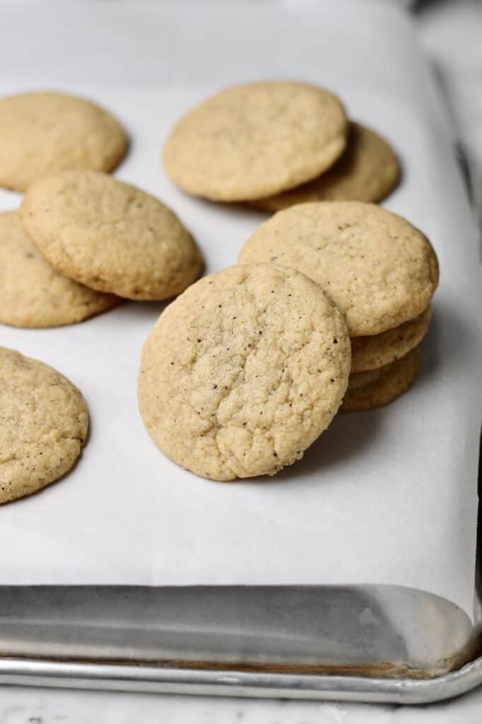 stack of cookies, sitting on white parchment paper