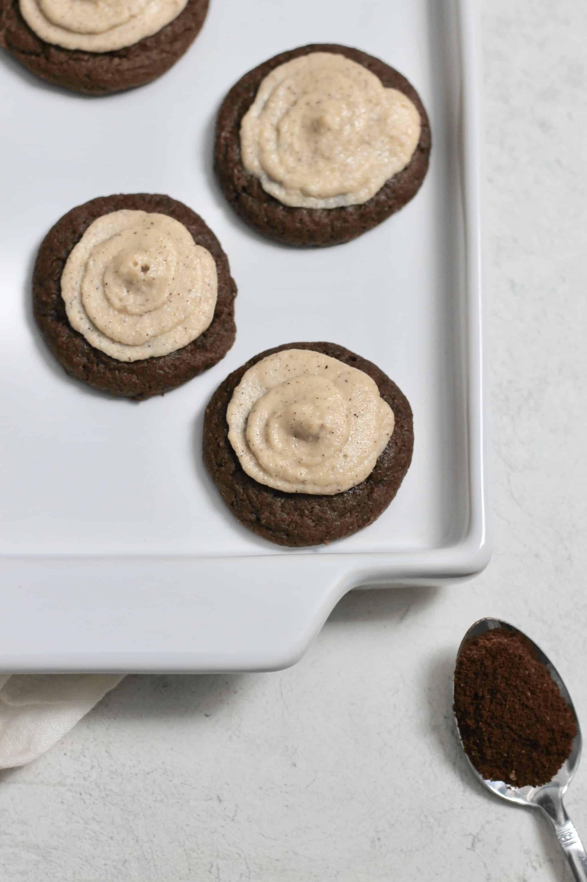 cookies with a mascarpone espresso frosting, sitting on a white tray