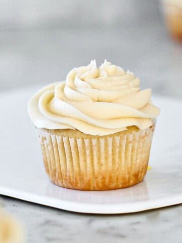 Vanilla cupcake topped with almond frosting.