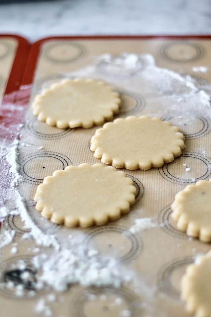 wreath sugar cookies, made with a scalloped round cookie cutter