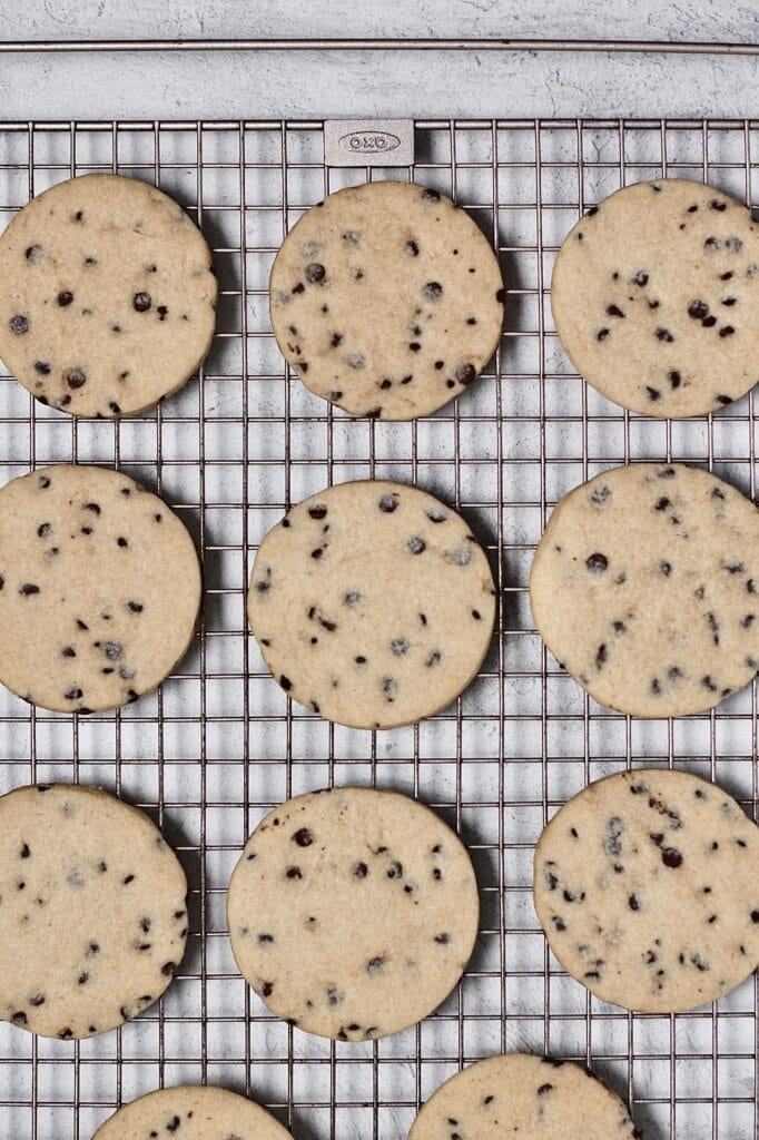 overhead image of baked chocolate chip sugar cookies on a wire rack