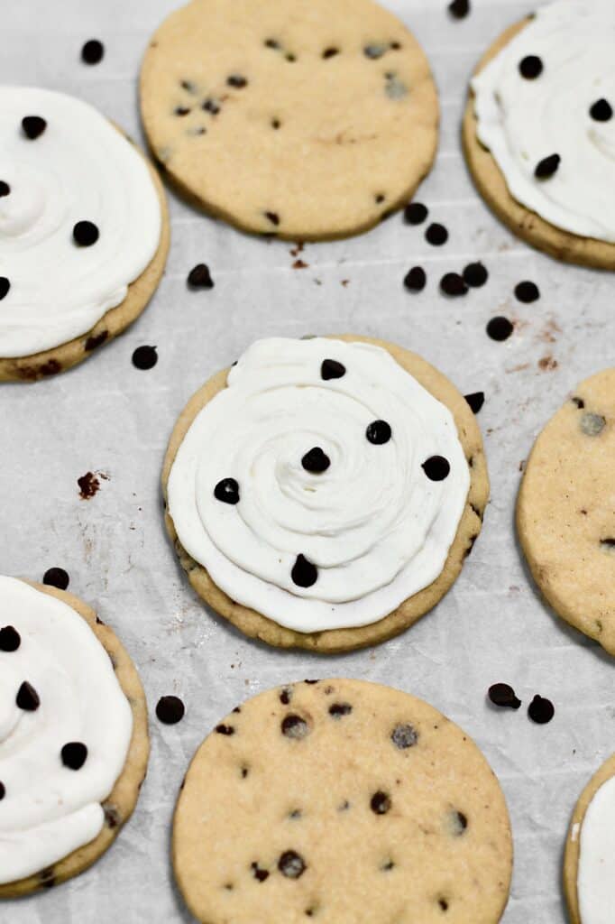 up-close image of frosted and unfrosted chocolate chip sugar cookies