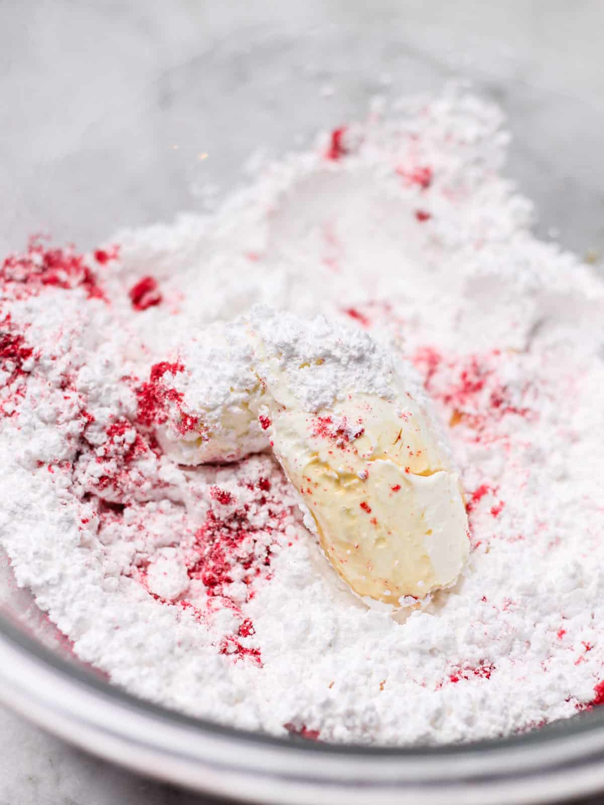 bowl of ingredients for raspberry glaze.