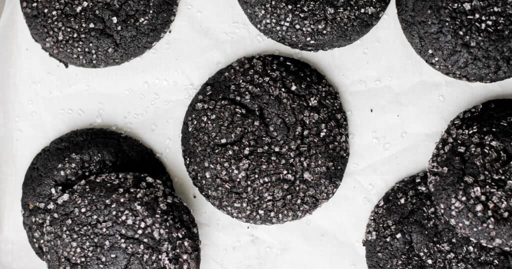 White sanding sugar coated on black cocoa powder cookies.