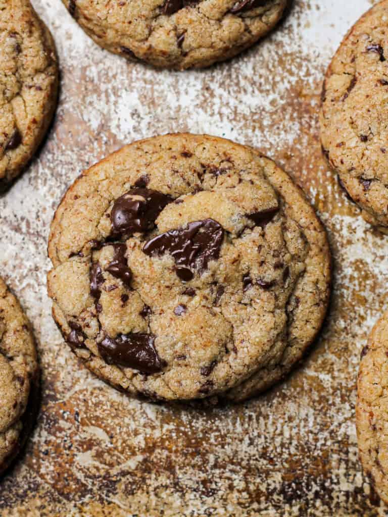 Up-close image of one cookie from a baked big batch chocolate chip cookie recipe.