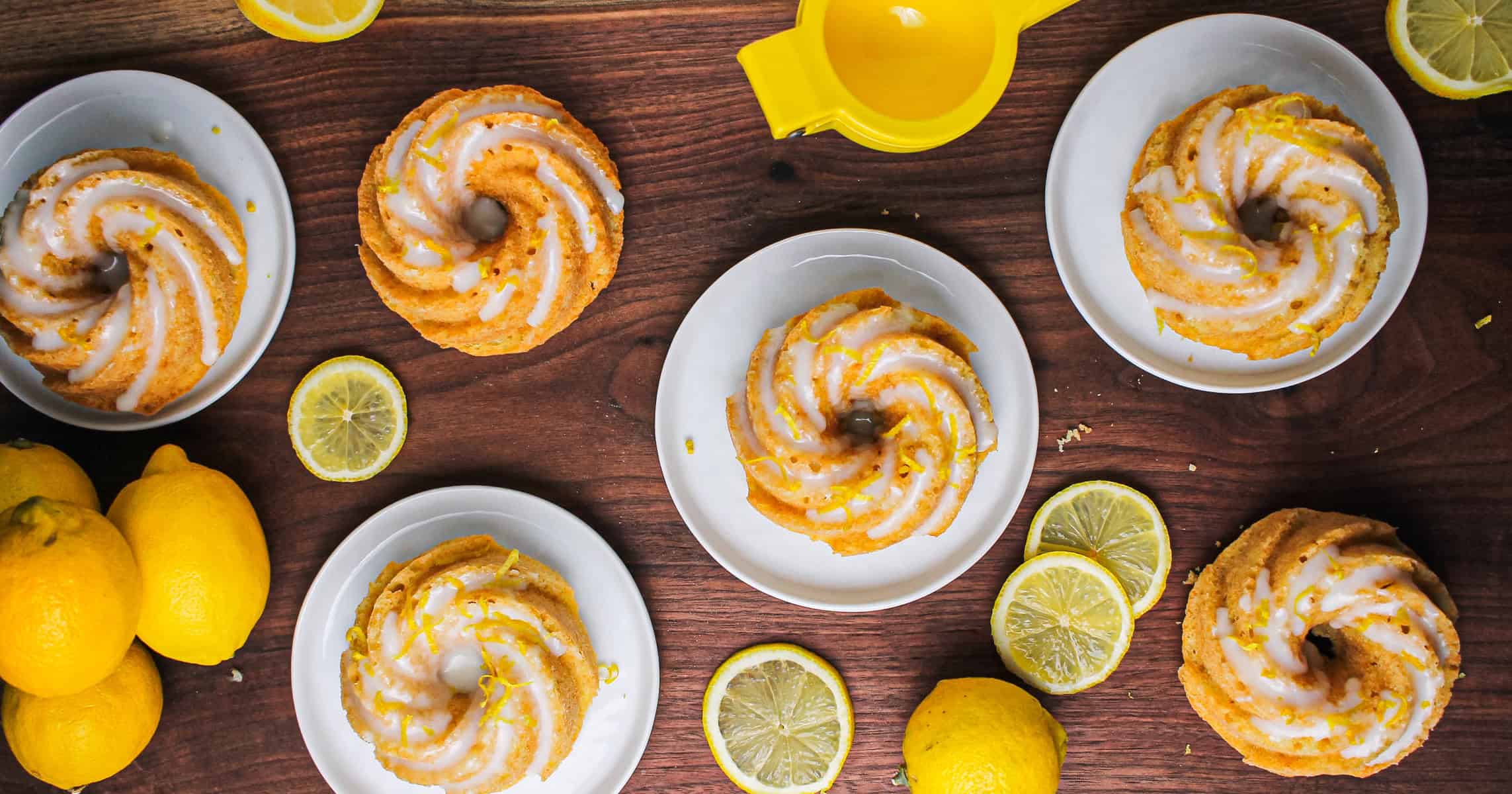 Overheard shot of 6 glazed lemon bundt cakes.