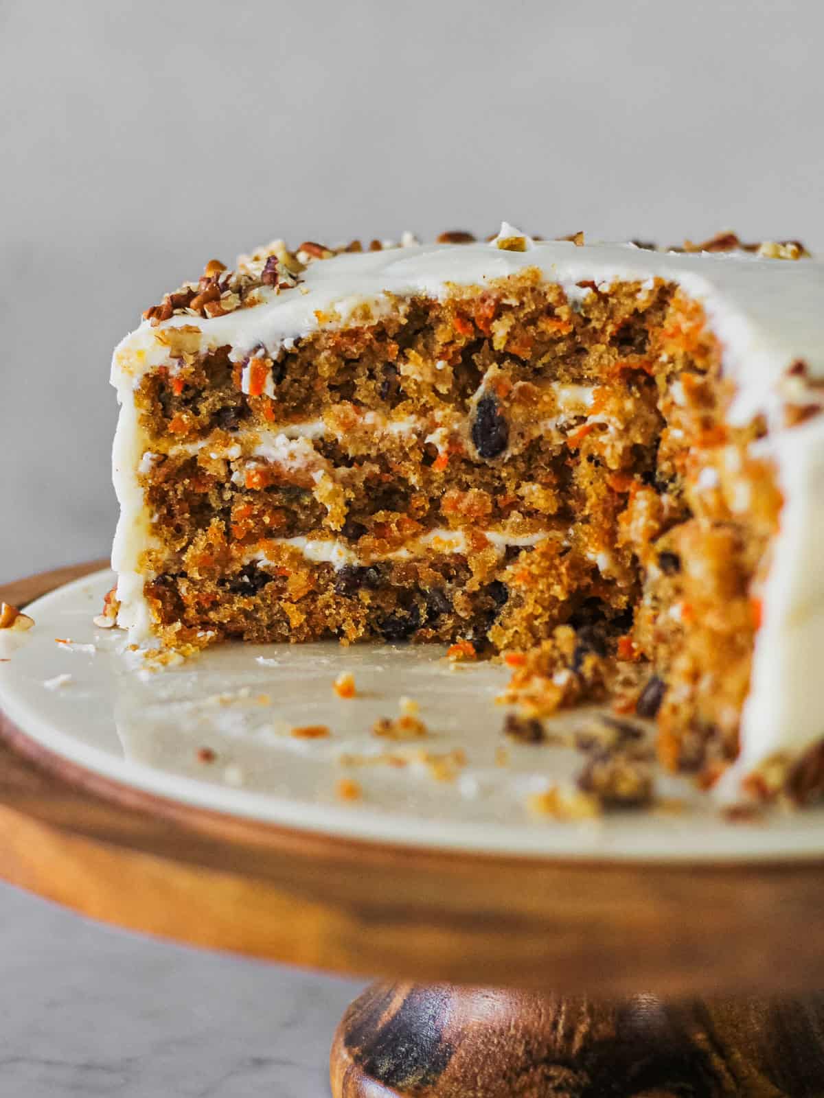 Inside cross section of a layer carrot cake made with pineapple and nuts. 