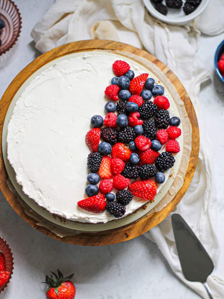 Overhead image of no bake mascarpone cheesecake with berries on top.